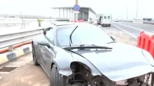 Days after tunnel fire, speeding Porsche crashes into Coastal Road divider, injures