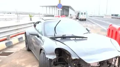 Days after tunnel fire, speeding Porsche crashes into Coastal Road divider, injures