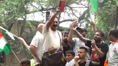 Prakash Raj waves the Indian Constitution at CJP's Chalo Sansad march in New Delhi.