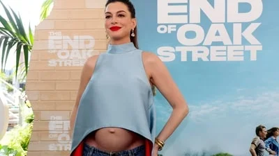 'Fake hair, real bump': Anne Hathaway hits back at trolls who called her baby bump
