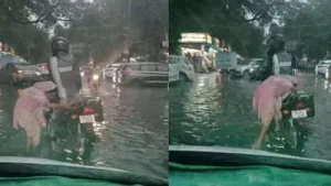 Delhi biker stops to help elderly woman walking through waterlogged road, wins