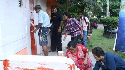 Theatre artists repaint Kolkata's Academy of Fine Arts white from saffron