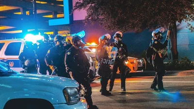 Reports have emerged that it is related to Alex Barnett , a suspect in the shooting of Tucson Police